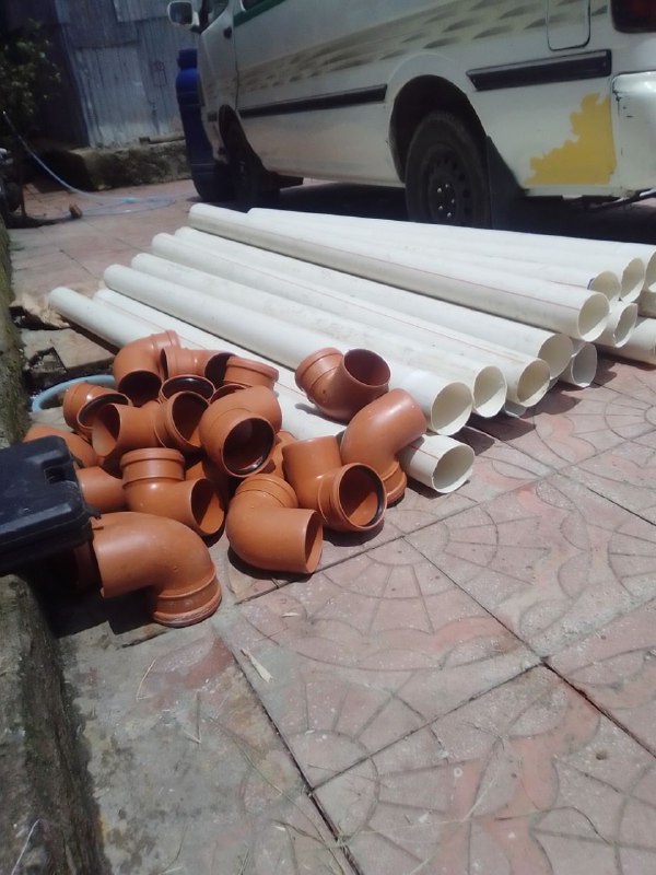 PVC drain pipes staged for installation